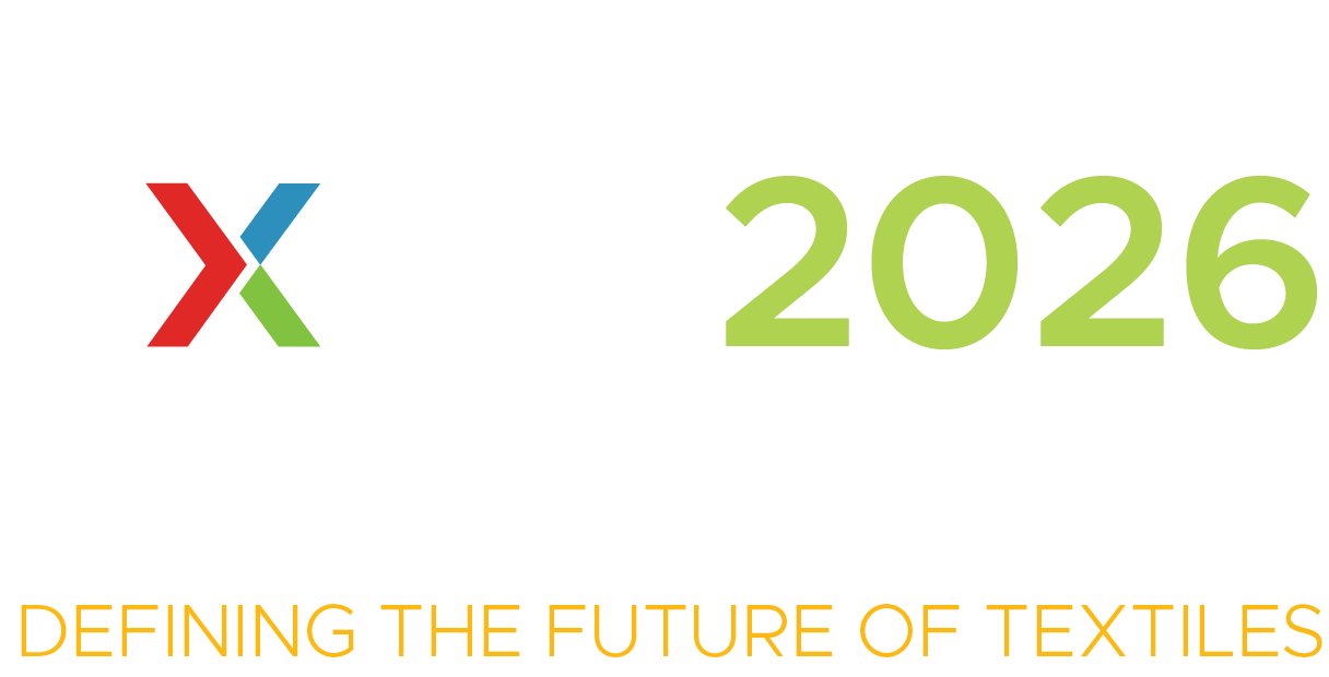 Logo featuring a stylized "X" in red, green, and blue, accompanied by the text "2026" in bright green and "DEFINING THE FUTURE OF TEXTILES" in orange.