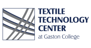 Logo featuring the text "Textile Technology Center" with stylized grey lines forming a geometric pattern, set against a white background.
