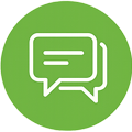 Green circular icon featuring two overlapping speech bubbles in white, symbolizing communication and dialogue.
