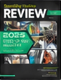 A black magazine cover featuring vibrant images of textiles and patterns, with a bold green title and white text detailing the issue year.